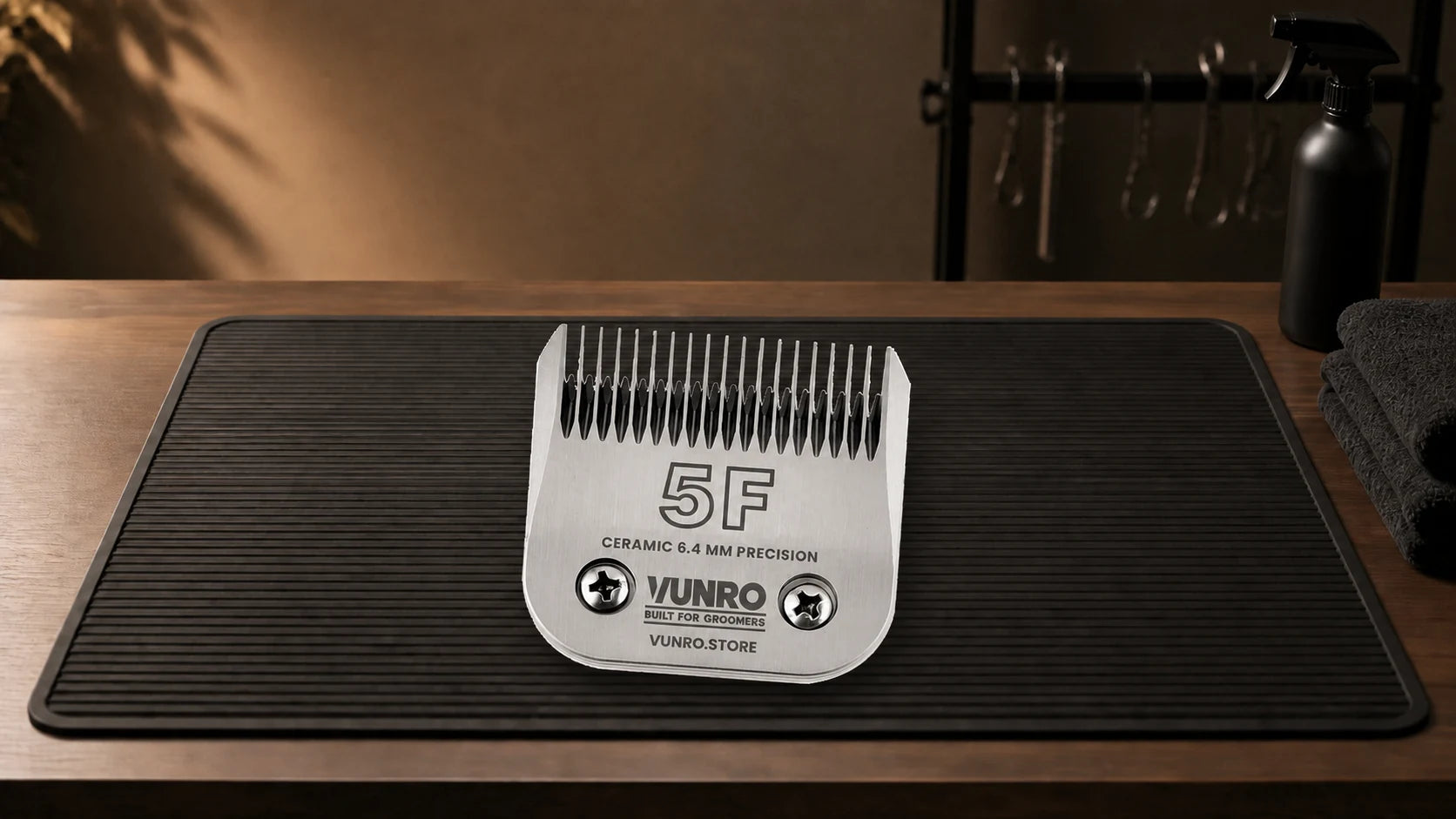 #5F Ceramic Dog Clipper Blade (6.4 mm) resting naturally on the VUNRO grooming workbench